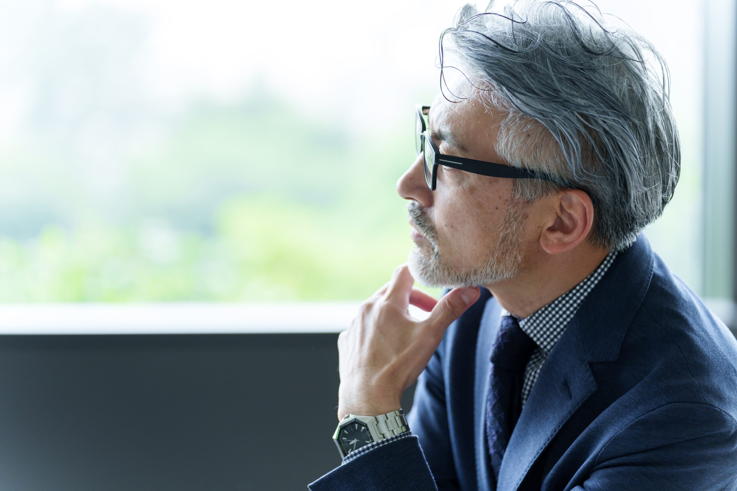 Portrait,Of,Middle,Aged,Fashionable,Businessman,Relaxing,In,The,Office