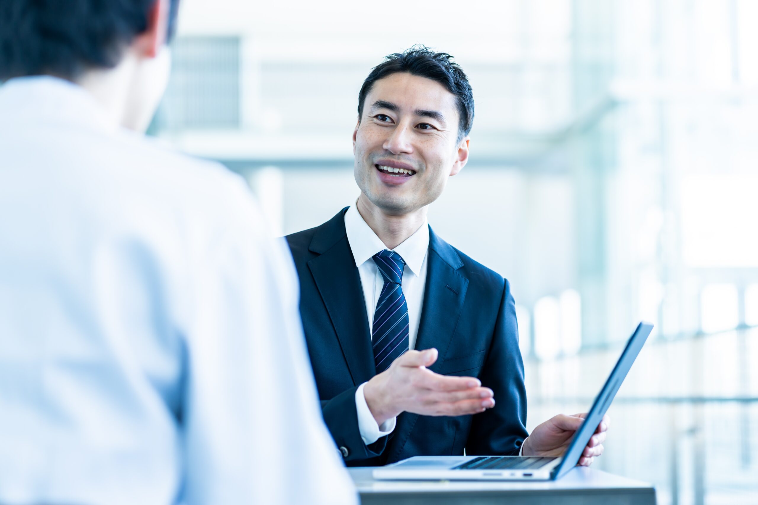 A,Business,Man,And,A,Japanese,Wearing,A,White,Coat