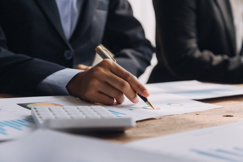 Financial,Analysts,Analyze,Business,Financial,Reports,On,A,Digital,Tablet